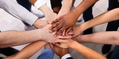 Hands gathered in a circle