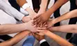 Hands gathered in a circle