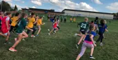 Elementary students running in a cross country meet