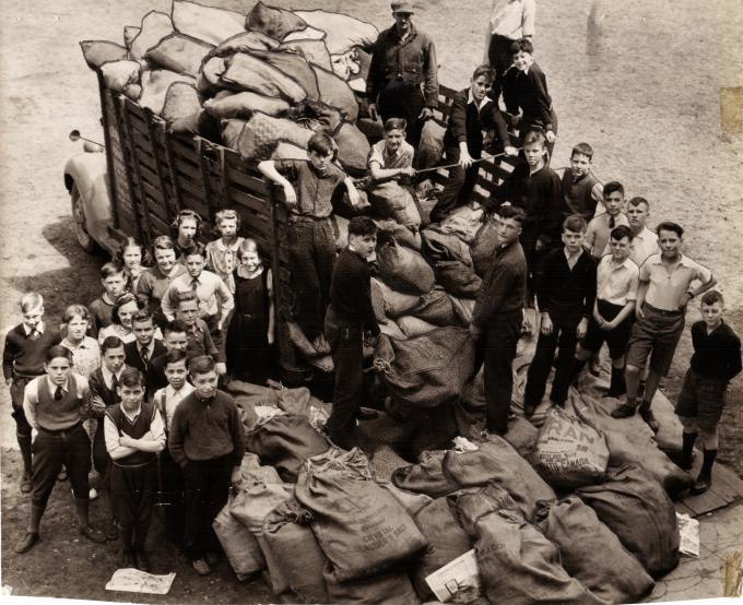 Students pose during the paper drive to raise money for the war.