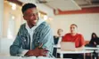 Teenage student smiling in class
