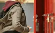Student in front of lockers