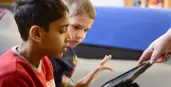 Special needs student using an electronic device