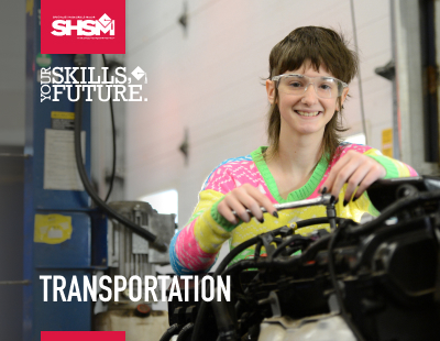 Student working on a car engine